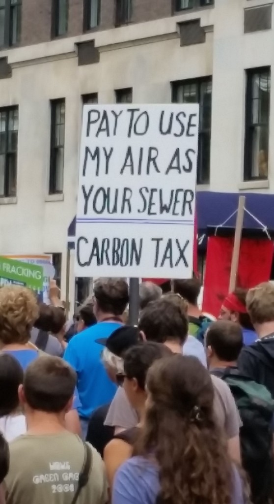 Sign from the People's Climate March, New York, September 21, 2014: Pay to use my air as your sewer: Carbon Tax
